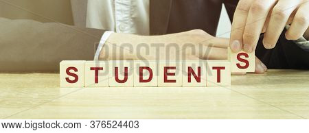 Man Made Word Students With Wood Blocks
