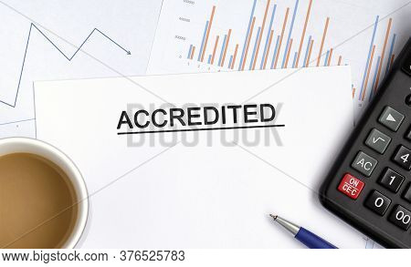 Accredited Document With Graphs, Diagrams And Calculator And A Cup Of Fragrant Coffee