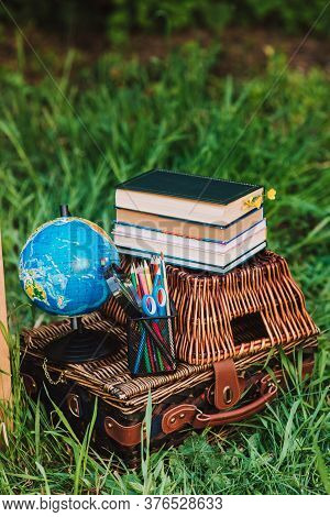 Back To School - School Equipment And Books On The Basket. Soft Focus