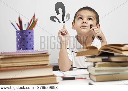 Thoughtful Schoolboy Having Idea, Raising Finger. I Know It. Primary School Pupil Thinking, Creating