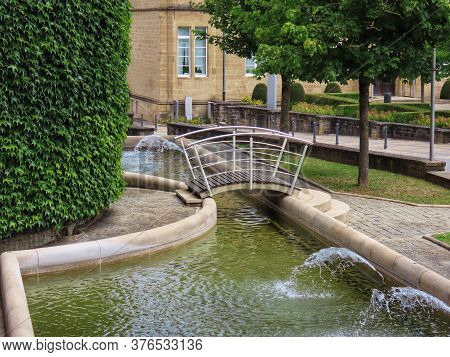Water Basin With Fountains And Park In Mersch, Luxembourg, On Sunny Summer Day