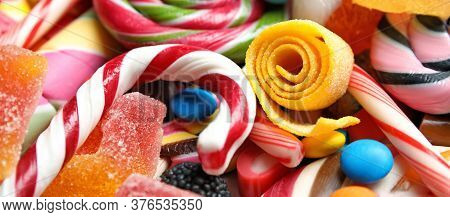 Many Different Yummy Candies As Background. Banner Design