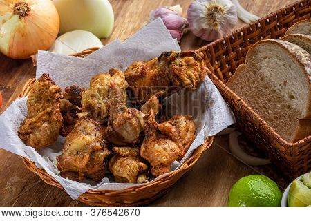 Brazilian Style Deep Fried Chicken And Sliced White Bread. Called Frango A Passarinho