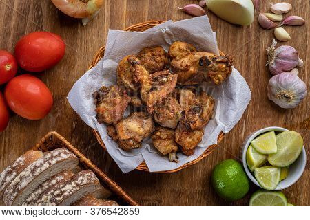 Brazilian Style Deep Fried Chicken And Sliced White Bread. Called Frango A Passarinho. Top View
