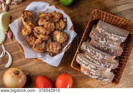 Brazilian Style Deep Fried Chicken And Sliced White Bread. Called Frango A Passarinho. Top View