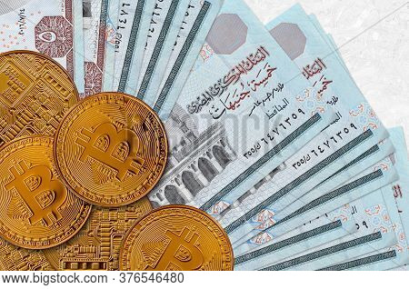 5 Egyptian Pounds Bills And Golden Bitcoins. Cryptocurrency Investment Concept. Crypto Mining Or Tra