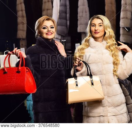 Women In Fur Coats With Bags In Shop.