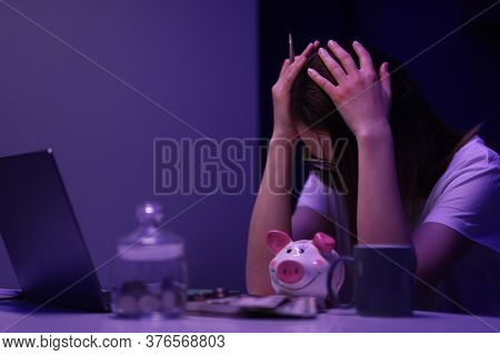 Close-up Of Glass Container With Coins. Depressed Woman Calculating Family Financial Situation. Lady