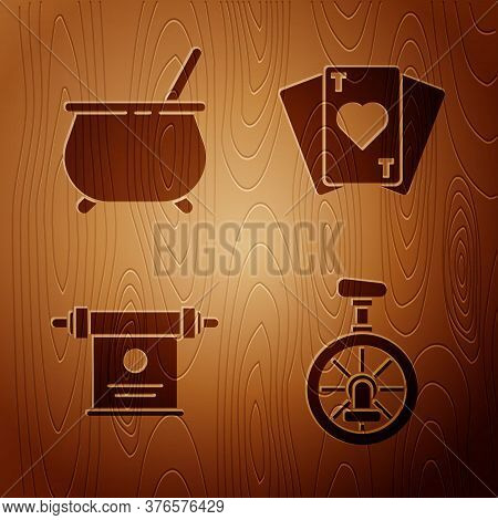 Set Unicycle Or One Wheel Bicycle, Witch Cauldron, Magic Scroll And Playing Cards On Wooden Backgrou