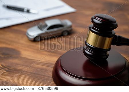 The Judge Hammer Is Next To The Car And Documents. Driver License Revocation Concept