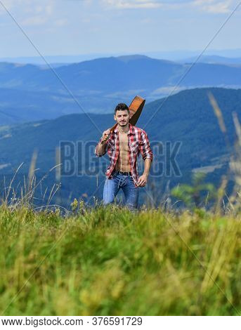 Radio Contact. Sexy Man With Guitar In Checkered Shirt. Hipster Fashion. Western Camping And Hiking.