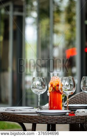 Served Table With Plates Wine Glasses Cool Fruit Lemonade Outside Summet Terrace, Vertical