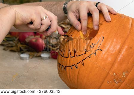 Process Of Carve Pumpkin With Knife For Decorating Holiday Of Halloween