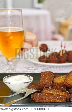 Garlic And Black Bread Snacks With Sour Cream And Greens Sauce. Perfect Snacks With Beer.