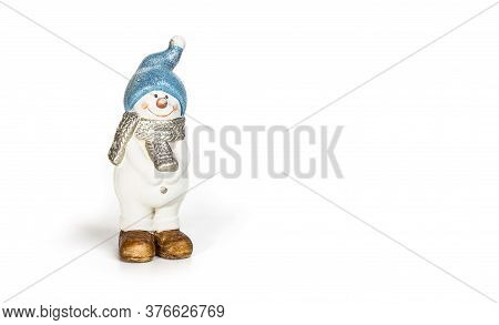 Snowman Ceramic Toy On A White Background
