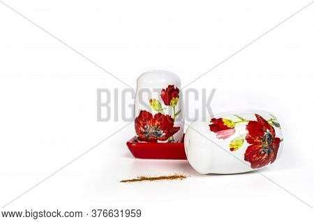 Salt And Pepper Shakers On A White Background