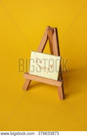 Sticker With Sorry Inscription On A Mini Easel. Im Sorry Lettering.