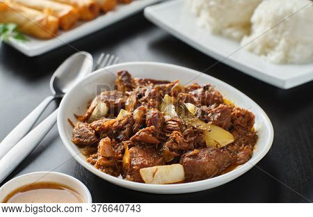 bowl of filipino pork adobo with rice