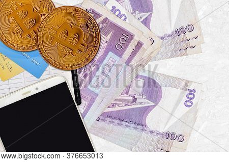 100 Philippine Piso Bills And Golden Bitcoins With Smartphone And Credit Cards. Cryptocurrency Inves