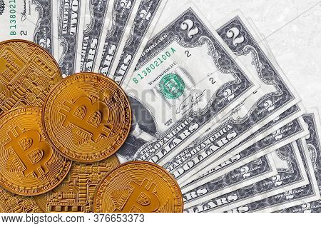 2 Us Dollars Bills And Golden Bitcoins. Cryptocurrency Investment Concept. Crypto Mining Or Trading