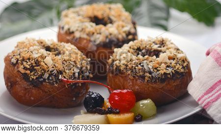 Close-up, Yummy Chocolate Donuts On A Whitel Plate With Various Topping