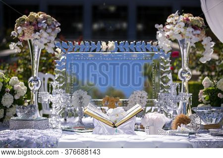 Traditional Wedding Setting For A Persian Ceremony With The Book Of Poetry And Other Decorations