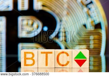 Btc Concept. Wooden Blocks With Btc Inscription And Arrows Symbolizing The Rise And Fall