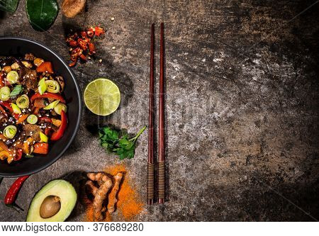 Asian food background with various ingredients on rustic stone background , top view. Vietnam or Thai cuisine.