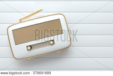 Vintage Style Radio Receiver On White Floor, Flat Lay. Whitel Color And Golden Details. Retro Radio 