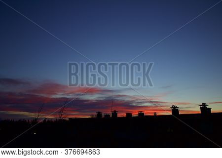Silhouette Of Buildings With Pinkish Red Twilight Sky In The Background Captured In Kiruna, Sweden