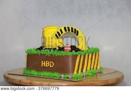 Edible Alloy Excavator Truck Car Vehicles And Pile Of Soil With Traffic Cone On The Square Chocolate
