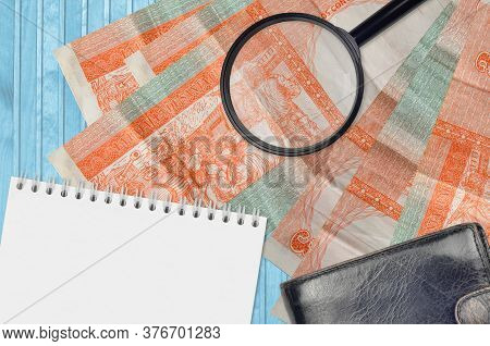 3 Cuban Pesos Convertibles Bills And Magnifying Glass With Black Purse And Notepad. Concept Of Count