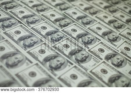Group Of Money Stack Of 100 Us Dollars Banknotes A Lot Of Is Arranged In A Beautiful, Selective Focu