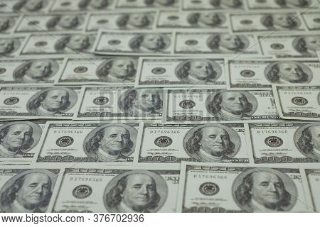 Group Of Money Stack Of 100 Us Dollars Banknotes A Lot Of Is Arranged In A Beautiful, Selective Focu