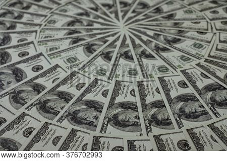Group Of Money Stack Of 100 Us Dollars Banknotes A Lot Of Is Arranged In A Beautiful, Selective Focu