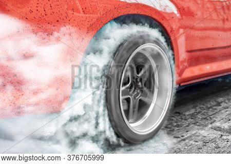 Drag Racing Car Burns Rubber Off Its Tires In Preparation For The Race