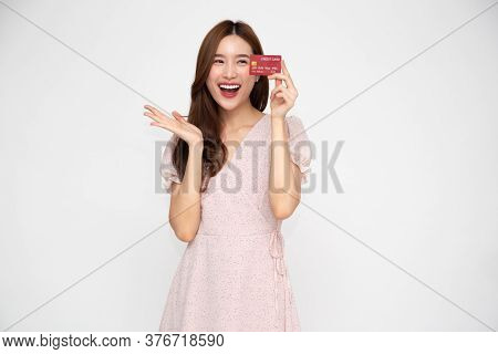 Young Beautiful Asian Woman Smiling Holding Credit Card Isolated On White Background