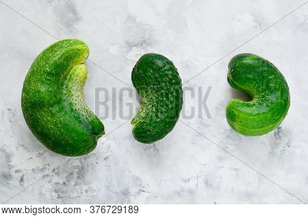 Trendy Ugly Vegetables. Fresh Ugly Cucumbers On A Concrete Background. Imperfect Food Non-standard, 
