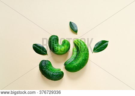 Trendy Ugly Vegetables. Fresh Ugly Cucumbers On A Beige Background. Imperfect Food Non-standard, Fun