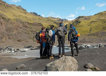 Tourists Hiking At Solheimajokull Glacier, Iceland