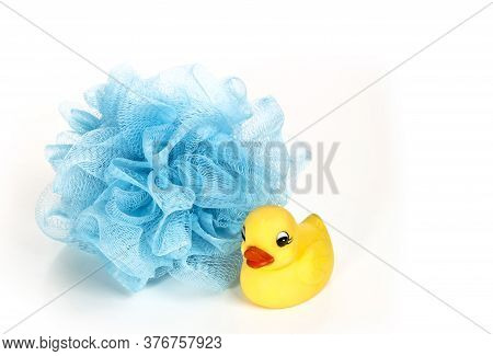 Yellow Rubber Duck Isolated On White Background And Sponge On White Background