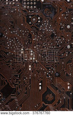 Modern printed brown circuit board, electronic circuit board, textolite. Background banner.