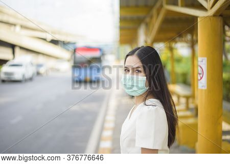 Beautiful Woman Is Wearing Face Mask In Bus Stop