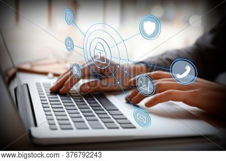 Information Security. Young Woman Using Laptop At Table Indoors, Closeup