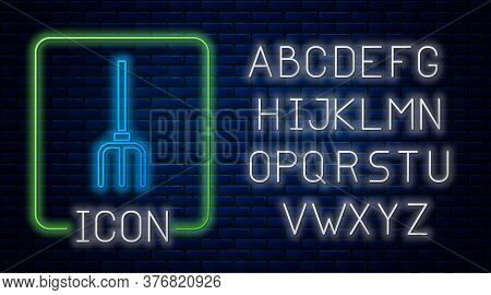 Glowing Neon Garden Pitchfork Icon Isolated On Brick Wall Background. Garden Fork Sign. Tool For Hor