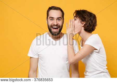 Excited Young Couple Friends Bearded Guy Girl In White T-shirts Posing Isolated On Yellow Orange Bac