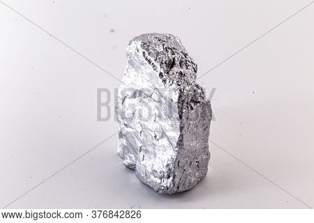 Macro Shot Of Nickel Metal Ore Piece Isolated On A White Background. Closeup Photo Of Surprising Shi