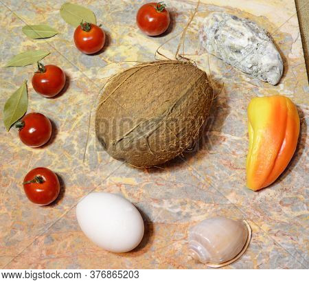 Vegetables, Fruits, Seashells And An Egg On A Marble Surface: Cherry Tomatoes, Bell Peppers, Bay Lea