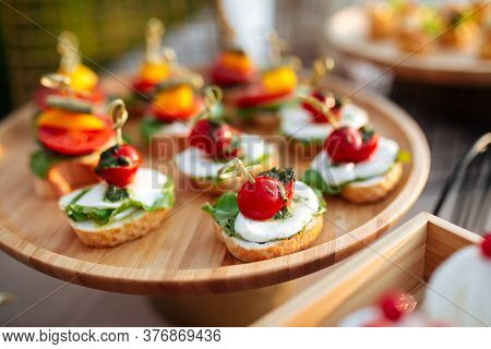 Closeup On Banquet Tappas Canape With Mozzarella Tomatoes And Pesto Sauce