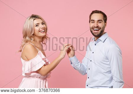 Smiling Young Couple Two Guy Girl In Party Outfit Celebrating Posing Isolated On Pastel Pink Backgro